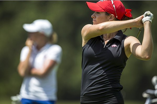 Razorback golfer Gaby Lopez hits from the fifth tee box with former Razorback golfer Stacy Lewis (left) on Tuesday, June 23, 2015, at Pinnacle Country Club in Rogers during practice rounds for the Walmart NW Arkansas Championship.