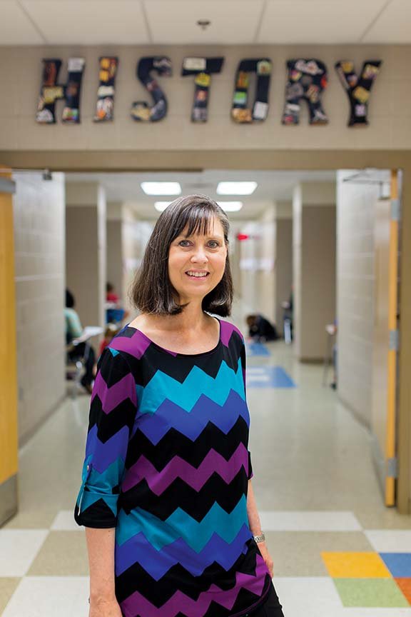 Sherry Holder stands in the hallway at Conway Junior High School, where she teaches Pre-AP Arkansas history and is chairwoman of the history department. Holder was named National History Day Patricia Behring Teacher of the Year last week at the University of Maryland at College Park. She will receive $10,000 for the national honor.