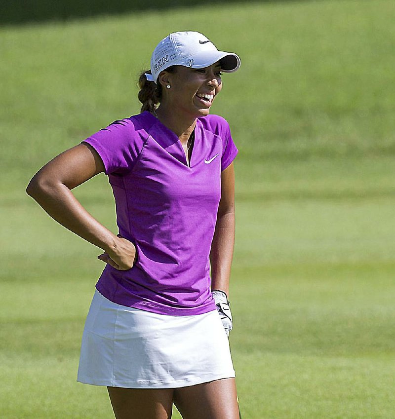 Professional golfer Cheyenne Woods chats with her playing partners on the ninth fairway during the pro-am play on Wednesday, June 24, 2015, at Pinnacle Country Club in Rogers as part of the NW Arkansas Walmart Championship.