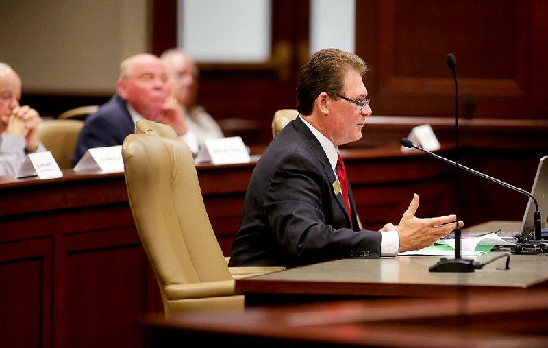 Arkansas Insurance Department Commissioner Allen Kerr speaks at a legislative committee meeting Wednesday in Little Rock.The House and Senate Insurance and Commerce committees met with the House and Senate Agriculture, Forestry and Economic Development committees and discussed problems with the state’s levee system.