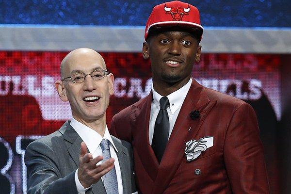 Bobby Portis, right, poses for photos with NBA commissioner Adam Silver after being selected 22nd overall by the Chicago Bulls during the NBA basketball draft, Thursday, June 25, 2015, in New York. (AP Photo/Kathy Willens)
