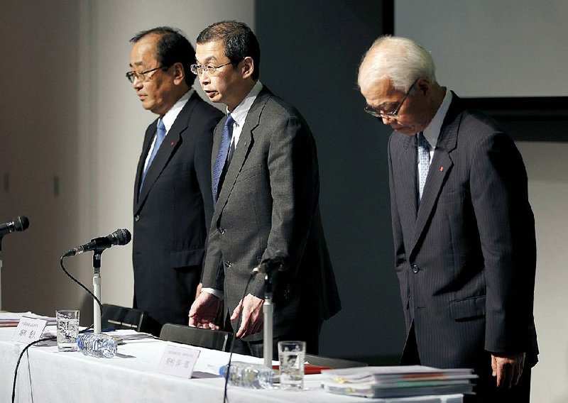 Takata Corp. Chief Executive Officer Shigehisa Takada (center) addresses reporters Thursday at the start of a news conference in Tokyo. 
