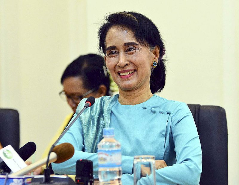 Burma opposition leader Aung San Suu Kyi holds a news conference Thursday in Naypyitaw. A vote to ease a rule that prevents her from being president failed in a parliament vote. 
