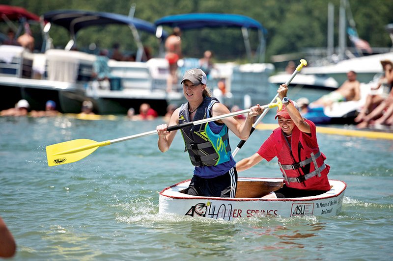 Madison Duff, left, and Jena Kelley race during last year’s World Championship Cardboard Boat Races at Sandy Beach in Heber Springs. Registration is underway for this year’s event, which will be held July 25 at Sandy Beach, unless high water forces the event to be moved to Dam Site Park, said Julie Murray, executive director of the Heber Springs Area Chamber of Commerce.