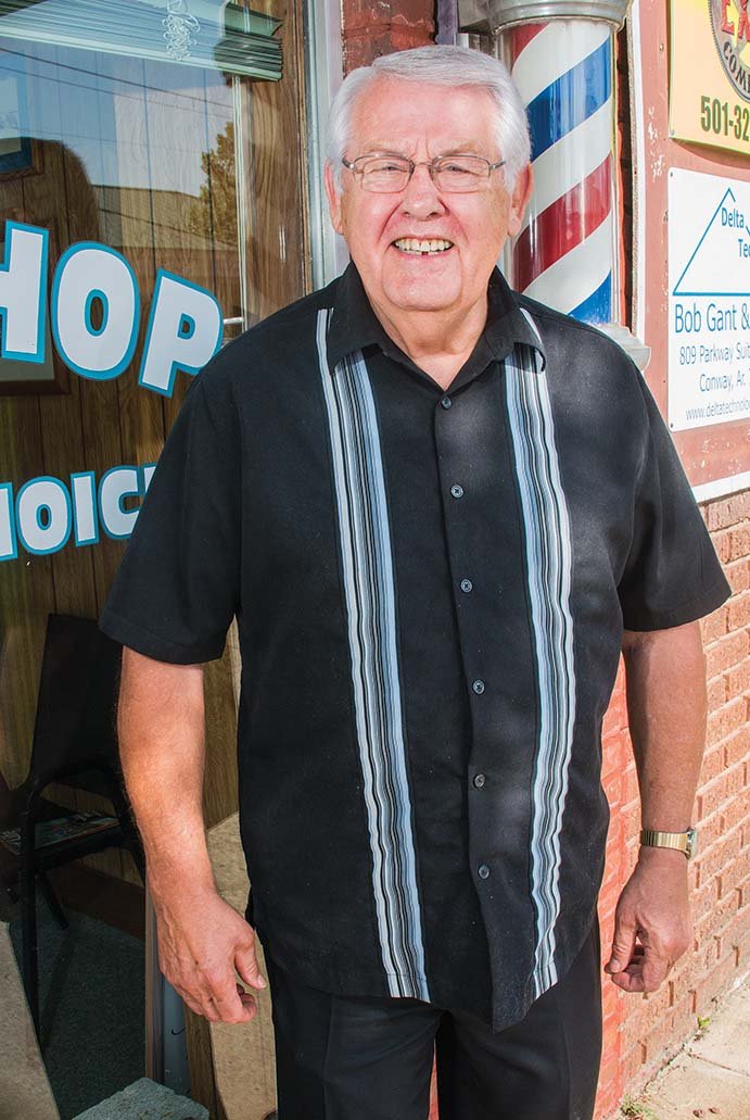 Russell Mills stands outside his barber shop, Gentleman’s Choice, in downtown Conway. He received his barber’s license in 1961, and other than a brief stint in Crossett, he has been in Conway ever since.