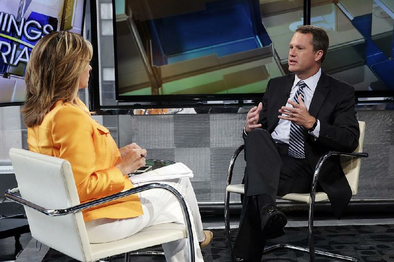 During an interview with Maria Bartiromo on Fox Business Network, Wal-Mart CEO Doug McMillon answers questions Tuesday about the retailer no longer selling Confederate-themed items. 