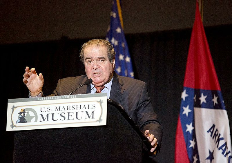 U. S. Supreme Court Associate Justice Antonin Scalia speaks as part of the first of three presentations in the Winthrop Paul Rockefeller Distinguished Lecture Series on Thursday, Feb. 26, 2015, inside the Fort Smith Convention Center. The U.S. Marshal's Service confirmed that Scalia has died at the age of 79.