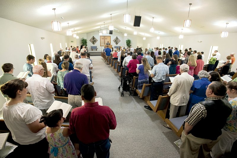 The congregation of the Fellowship Bible Church of Springdale fills the sanctuary for a worship service June 7. The church celebrates its 50th anniversary Sunday.