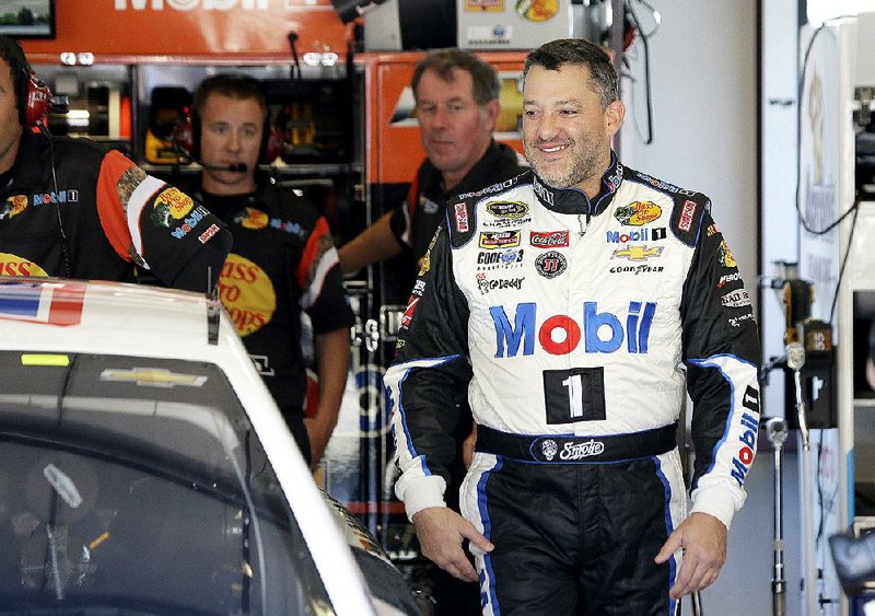 Tony Stewart walks to his car during practice for the NASCAR Sprint Cup Series auto race in Sonoma, Calif., on Friday. Stewart has not won a Sprint Cup race since June 2013 and is currently 26th in the series standings with only one top-10 finish.