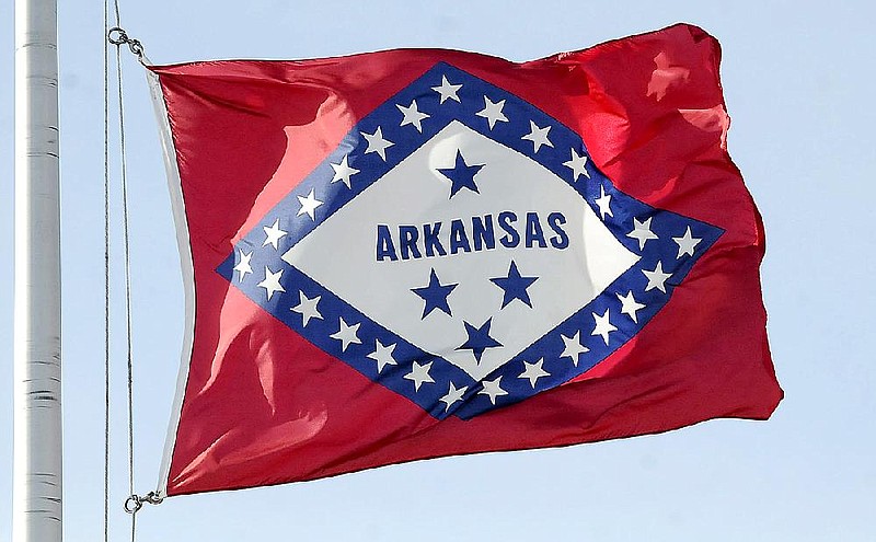 The Arkansas flag has four blue stars, the top one for the Confederacy and the bottom three for Spain, France and the United States. 