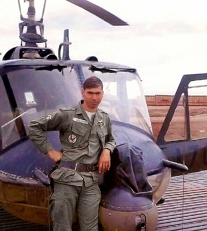 Sam Grimes, 21, poses with a Bell UH-1C Iroquois in April 1967 when he was serving as the helicopter’s crew chief in Vietnam. Using an online database, Grimes, now 69 and living in Snowflake, Ariz., tracked the helicopter to the Jacksonville Museum of Military History.