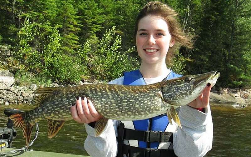 Rheanna Fuller of Fayetteville added this big northern pike to the family’s mixed bag of game fish caught at Lac Seul in Ontario, Canada.