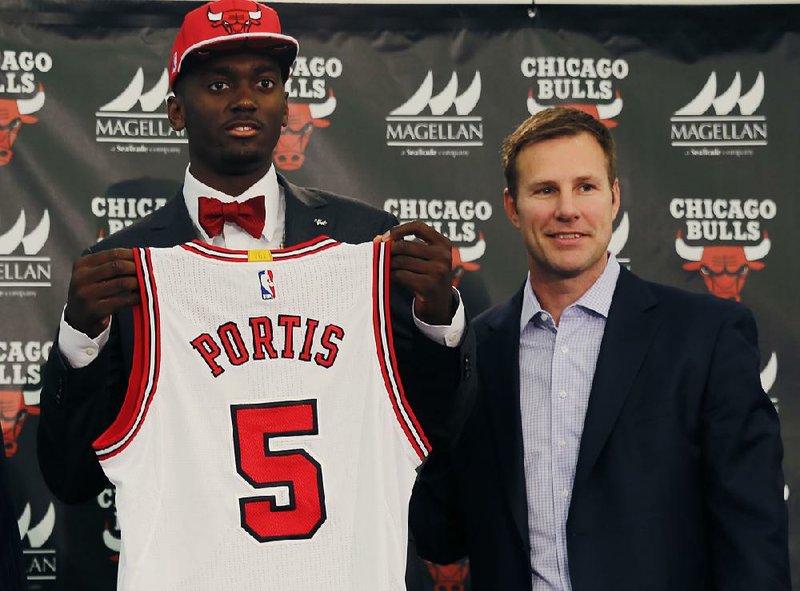 Chicago Bulls Coach Fred Hoilberg (right) introduces the Bulls' first round draft pick, former Arkansas Razorback Bobby Portis (Little Rock Hall), during a news conference Monday in Chicago. According to Hoilberg, Portis, the SEC player of the year, will have a chance to play his way into the Bulls’ rotation over the summer and in training camp.