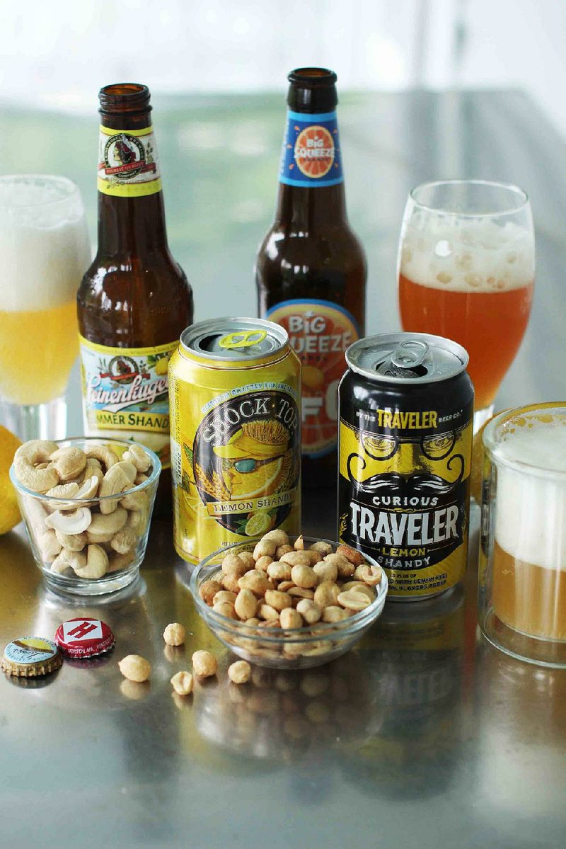 This June 15 photo shows MillerCoors' Leinenkugel's Summer Shandy, Shock Top Lemon Shandy from Anheuser-Busch, Harpoon Brewery's UFO Big Squeeze Shandy and Curious Traveler Lemon Shandy from The Traveler Beer Co. in Concord, N.H.