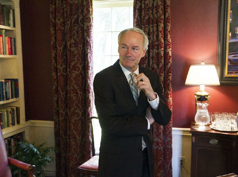 Governor Asa Hutchinson talks to the media from the Governor's Mansion in this undated file photo.