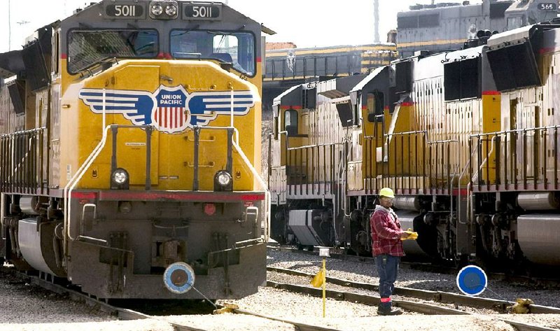 Union Pacific Corp. locomotives are positioned for refueling at the Belt Railway switching yard in Chicago in this file photo. Lower demand for coal, oil and grain has slowed business for U.S. railroads.