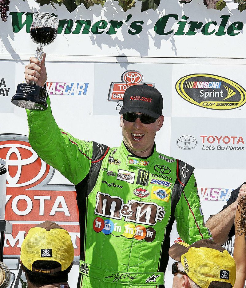 Kyle Busch outlasted his brother Kurt down the stretch to win the NASCAR Sprint Cup Toyota/Save Mart 350 on Sunday in just his fifth race back since breaking his right leg and left foot on Feb. 21.