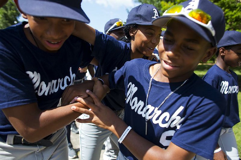 Anderson Monarchs players Tee Rainey (left), Mo’ne Davis (center) and Myles Eaddy joke around during their stop in Little Rock as part of a 23-day tour of civil rights sites. The team is receiving extra attention because half of them played in last year’s Little League World Series, with Davis being featured on the cover of Sports Illustrated.