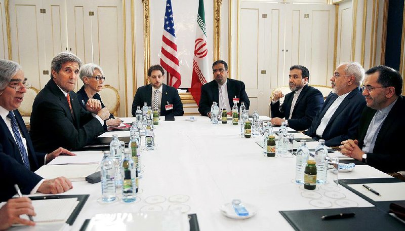 U.S. Secretary of Energy Ernest Moniz (from left), U.S. Secretary of State John Kerry and U.S. Undersecretary for Political Affairs Wendy Sherman attend a meeting with Iranian Foreign Minister Mohammad Javad Zarif (second from right) at a hotel in Vienna on Sunday.