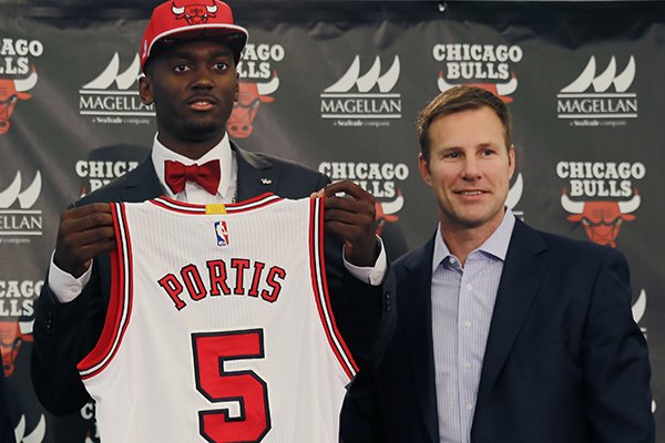 Chicago Bulls Head Coach, Fred Hoilberg, right, stands with the Chicago Bulls first round draft pick, Bobby Portis, from the University of Arkansas, as Portis holds his Bulls jersey after being introduced as the Bulls’ top pick during an NBA basketball news conference Monday, June 29, 2015, in Chicago. (AP Photo/Christian K. Lee)