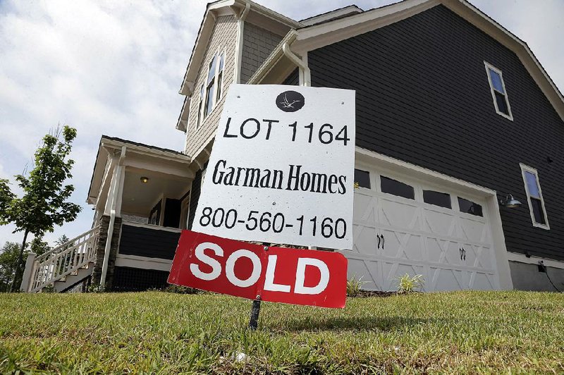 A sold sign stands outside a new home in the Briar Chapel community in Chapel Hill, N.C., on June 9. 