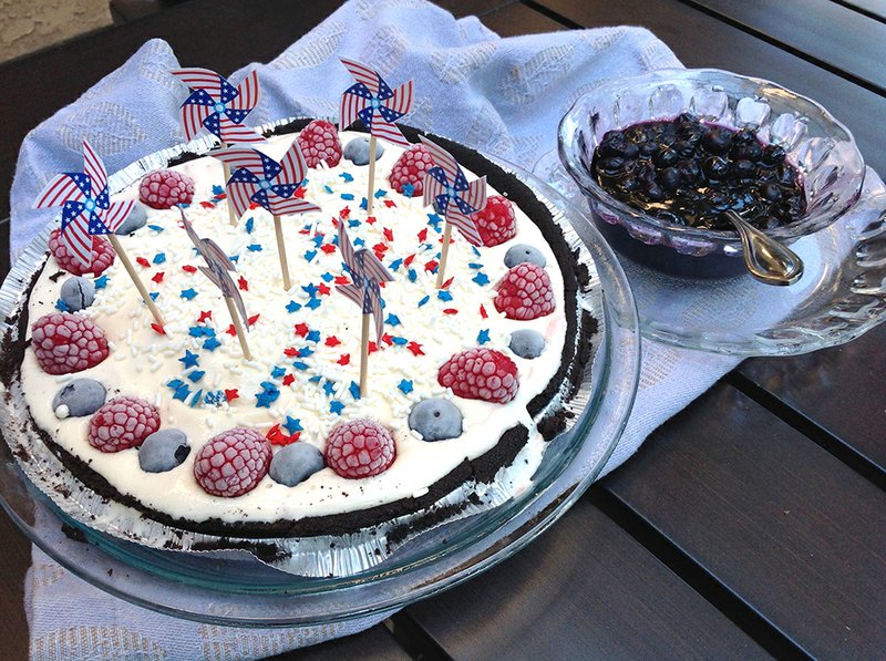 Go red, white and blue with your dessert, serving a strawberry and vanilla ice cream sundae pie with blueberry sauce.