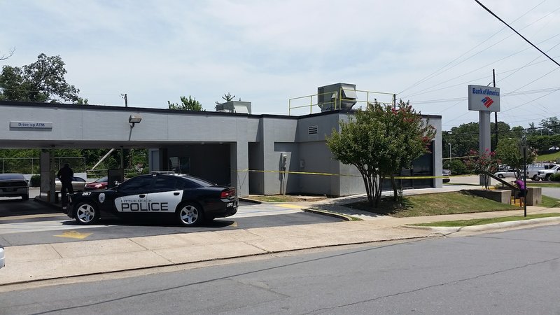 Little Rock police investigate a robbery at the Bank of America at 4024 W. Markham St. on Wednesday, July 1. 