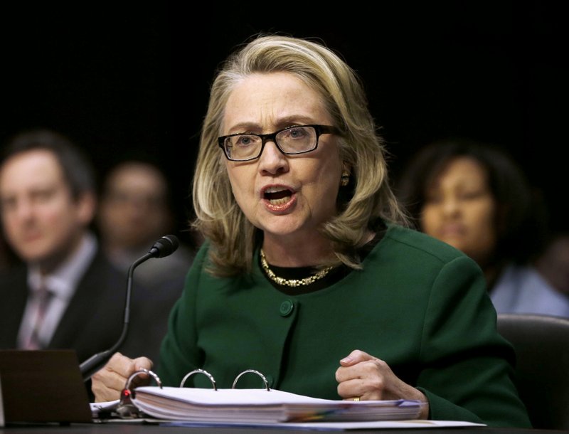 In this Jan. 23, 2014, then-Secretary of State Hillary Rodham testifies on Capitol Hill in Washington before the Senate Foreign Relations Committee hearing on the deadly September attack on the U.S. diplomatic mission in Benghazi, Libya, that killed Ambassador Chris Stevens and three other Americans.  