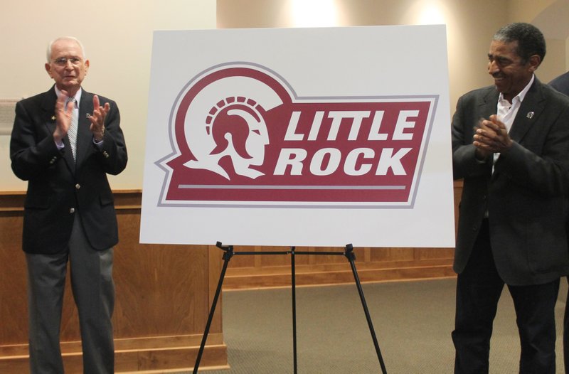 Former University of Arkansas at Little Rock men's basketball coach Bill Ballard and UALR Athletics Hall of Fame member Ron Sheffield helped unveil new athletic logos in the Bailey Alumni Center on Wednesday, July 1, 2015. 