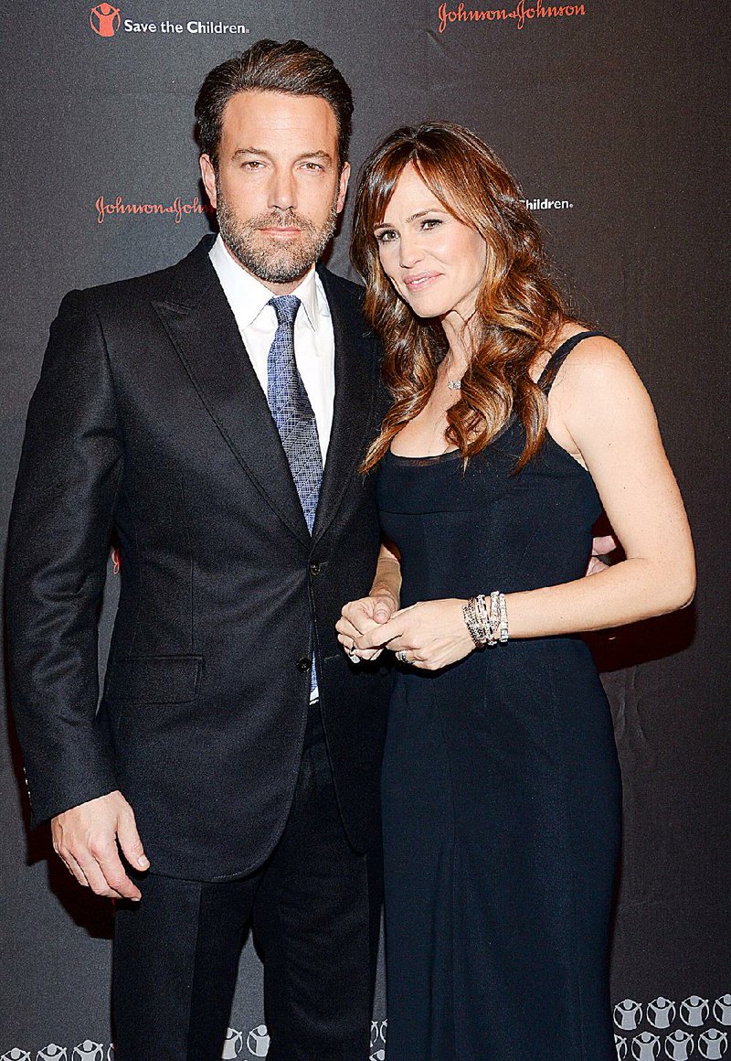 In this Nov. 19, 2014 file photo, actor Ben Affleck and his wife actress Jennifer Garner attend the 2nd Annual Save the Children Illumination Gala in New York. The couple have decided to divorce after 10 years of marriage, they announced in a joint statement Tuesday, June 30, 2015.