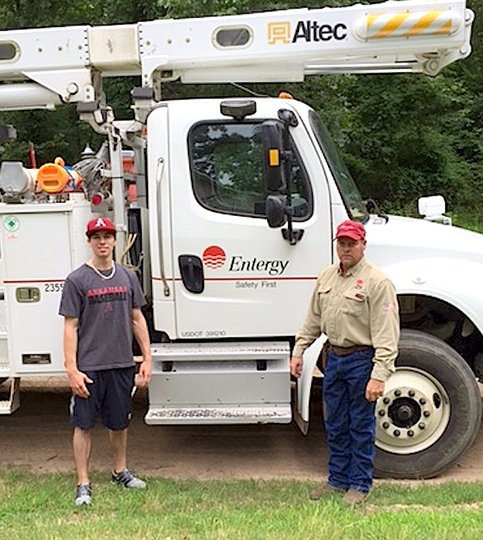 Submitted photo Power Scholarship: Recent Lake Hamilton High School graduate Jacob Crumpler, left, was one of four Arkansas high school seniors selected by Entergy Arkansas to receive a $5,000 Entergy Community Power Scholarship. His father Jimmy Crumpler, right, is a journeyman serviceman with Entergy Arkansas.