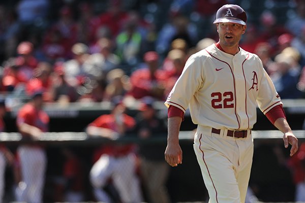 Arkansas assistant coach Tony Vitello speaks to an umpire against Mississippi Saturday, March 28, 2015, at Baum Stadium in Fayetteville.