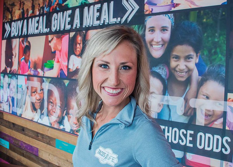 Ashton Samuelson and her husband, Austin, are co-founders of the Tacos 4 Life Grill, which they use as a way to help feed hungry children in Africa. A native of Arkadelphia, Ashton recently spoke to the fifth Arkadelphia Promise class of high school graduates.