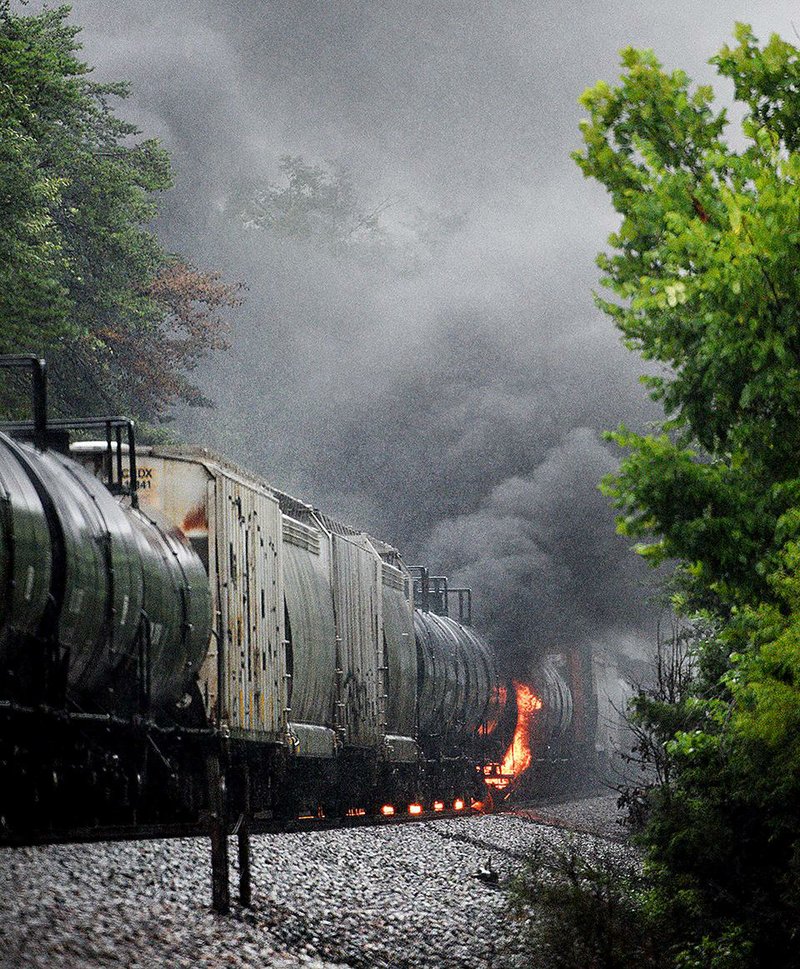 Smoke rises Thursday from a CSX train after a derailment late Wednesday in Maryville, Tenn. Thousands of nearby residents were evacuated after a car began leaking a flammable chemical that’s dangerous if inhaled. 
