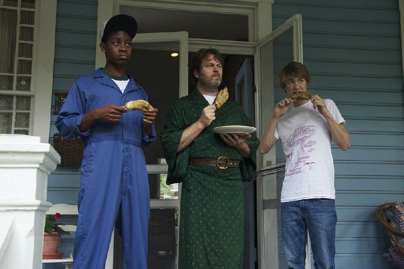 Earl (RJ Cyler), Greg’s Asian-snack-obsessed dad (Nick Offerman) and Greg sample some pigs feet in Me and Earl and the Dying Girl.
