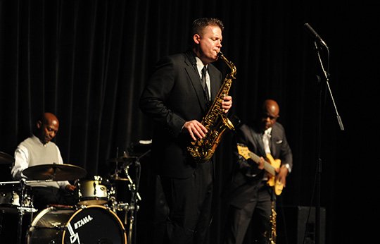 The Sentinel-Record/Mara Kuhn SOPHISTICATED SOUNDS: Grady Nichols, center, and two of his band members, Joe Nathan Watkins and Chuck Tottress, perform during the Lupus Foundation of Arkansas' 2014 An Evening with Grady Nichols Smooth Jazz Concert. This year's concert fundraiser will be held on Aug. 8 in the Wally Allen Ballroom of Little Rock's Statehouse Convention Center. Tickets are now on sale.