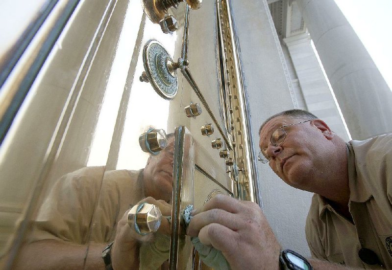 Richard Adcock has spent thousands of hours polishing the bronze doors of the state Capitol since he took on the chore seven years ago. 
