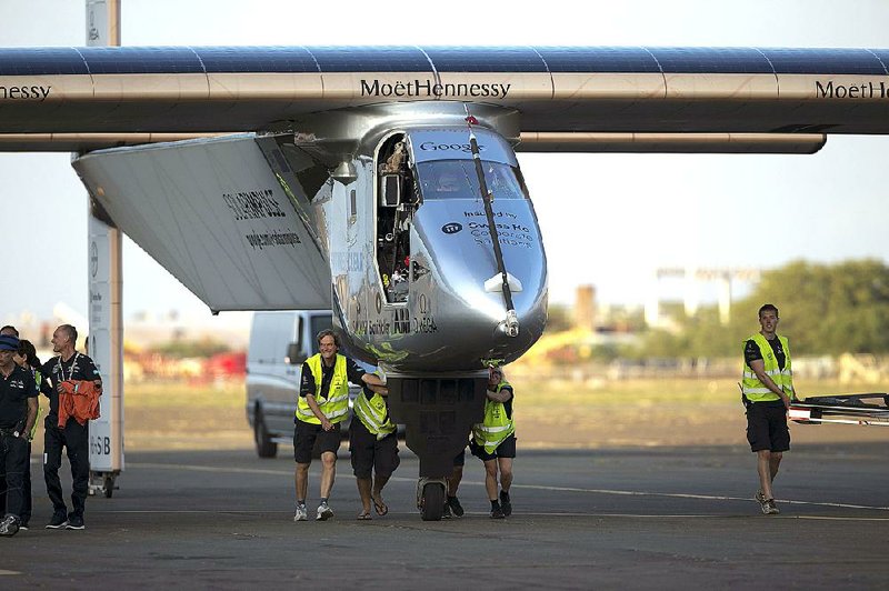 The Solar Impulse 2 is pushed toward a hangar Friday at Kalaeloa Airport in Kapolei, Hawaii, after its record-breaking flight. 