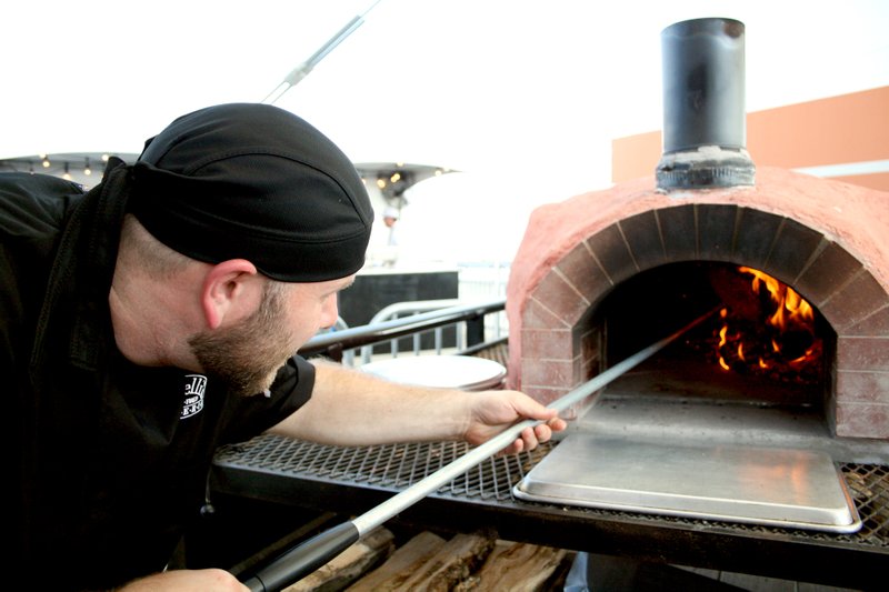 Tom Leadabrand, co-owner of Fratelli&#8217;s Wood-Fired Pizzeria, spent most of his night at the food fair working the mobile wood-fired oven at his restaurant&#8217;s booth, but he still had a good time, he said.