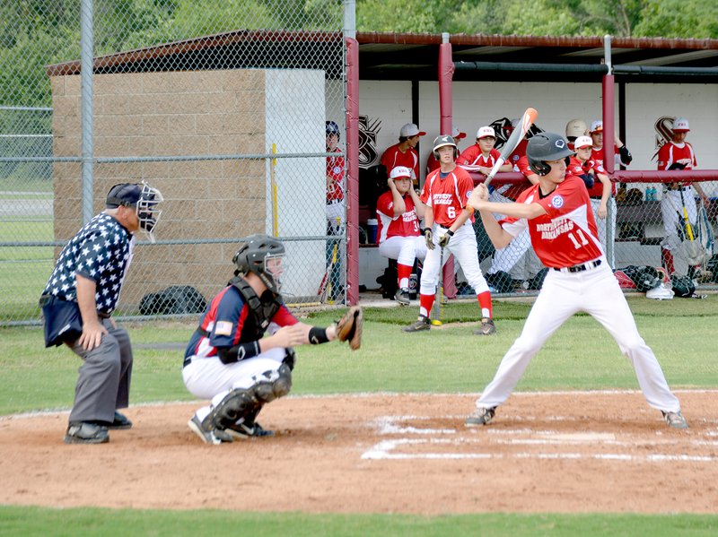 Graham Thomas/Siloam Sunday Eli Hawbaker, of Siloam Springs, loads up for a swing Friday while playing for the Northwest Arkansas All-Stars against Bentonville in the 16-year-old North Arkansas Babe Ruth State Tournament at James Butts Baseball Complex in Siloam Springs. The game between NWA and Bentonville on Friday was suspended by rain and completed on Saturday. Siloam Springs Youth Baseball also hosted the 18-year-old North Arkansas Babe Ruth State Tournament on Saturday, and it is scheduled to continue today.