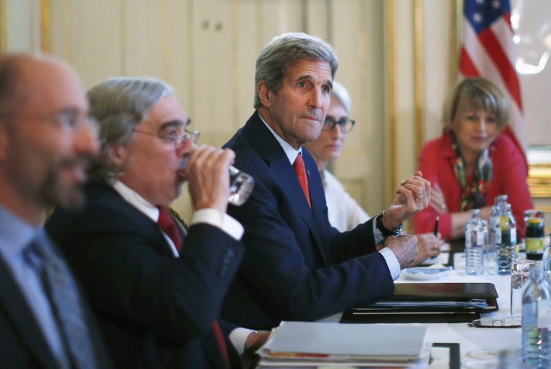 U.S. Secretary of State John Kerry, center, meets with Iranian Foreign Minister Mohammad Javad Zarif in Vienna, Austria, Friday July 3, 2015.  