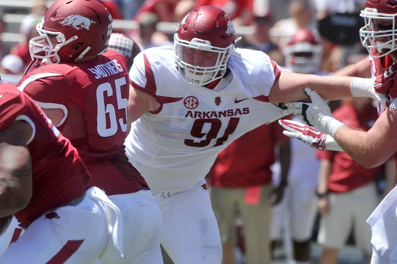 Arkansas defensive lineman Hjalte Froholdt tries to fight through the line during the 2015 Red-White game Saturday, April 25, 2015, at Razorback Stadium in Fayetteville.