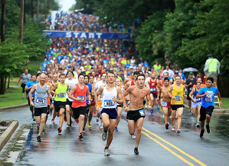 Runners take off at the start of the 39th running of the Firecracker Fast 5K on Saturday. A field of 1,253 finished the race, which began at the intersection of Kavanaugh Boulevard and North University and finished near War Memorial Stadium.