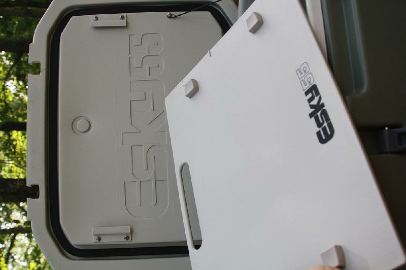 The Esky 55 has a cutting board tucked under the bottom of its lid. The board and the box interior are treated with an antimicrobial additive to discourage odors.