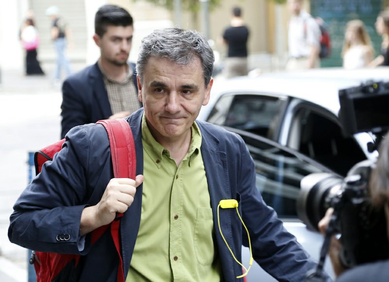 This is a Sunday, June 28, 2015, file photo of Greece's Deputy Foreign Minister for international economic relations, Euclid Tsakalotos, as arrives at the Finance Ministry in Athens. Following Sunday's referendum the Greek government named lead bailout negotiator Euclid Tsakalotos as the new finance minister Monday, July 6, 2015.