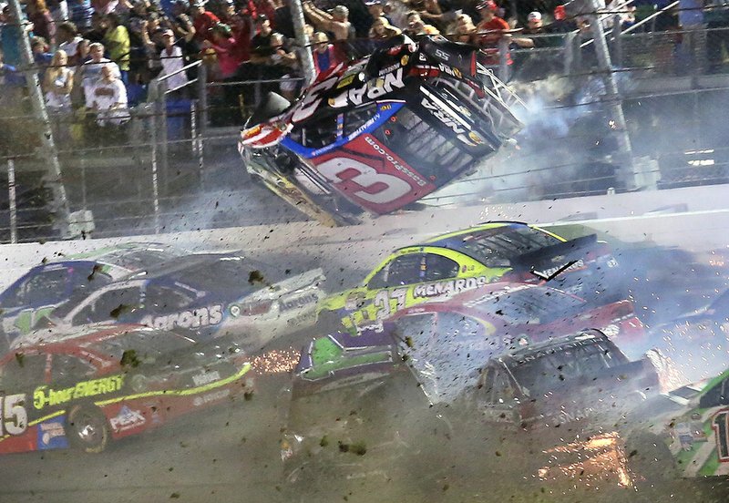 Austin Dillon (3) goes airborne as he was involved in a multicar crash on the final lap of the NASCAR Sprint Cup series auto race at Daytona International Speedway on Monday, July 6, 2015, in Daytona Beach, Fla. 