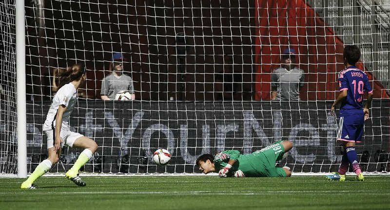 Japan goalkeeper Ayumi Kaihori (center) watches the first of four United States first-half goals go through the net during the Women’s World Cup final Sunday in Vancouver, British Columbia. The Americans jumped out to a 4-0 lead and never looked back in coasting to a 5-2 victory in front of 53,341 at BC Place Stadium.