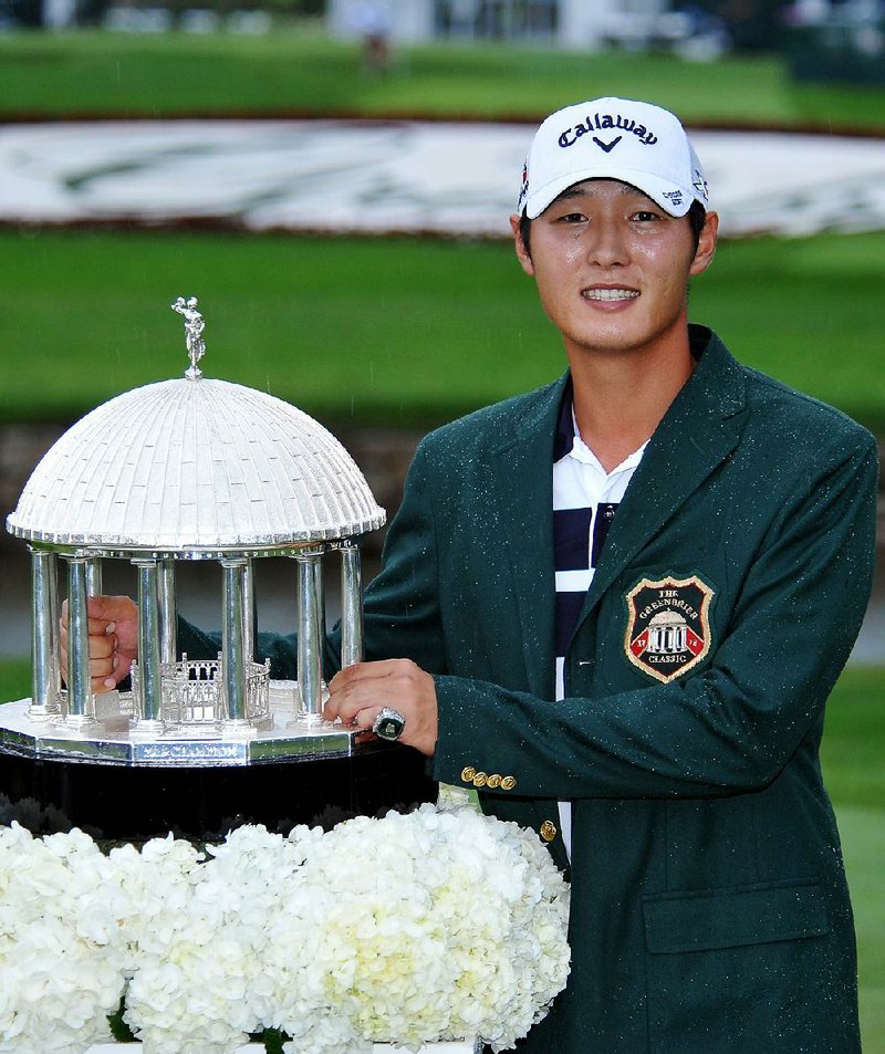 Danny Lee poses with the trophy after winning the Greenbrier Classic golf tournament at Greenbrier Resort in White Sulphur Springs, W.Va., on Sunday.