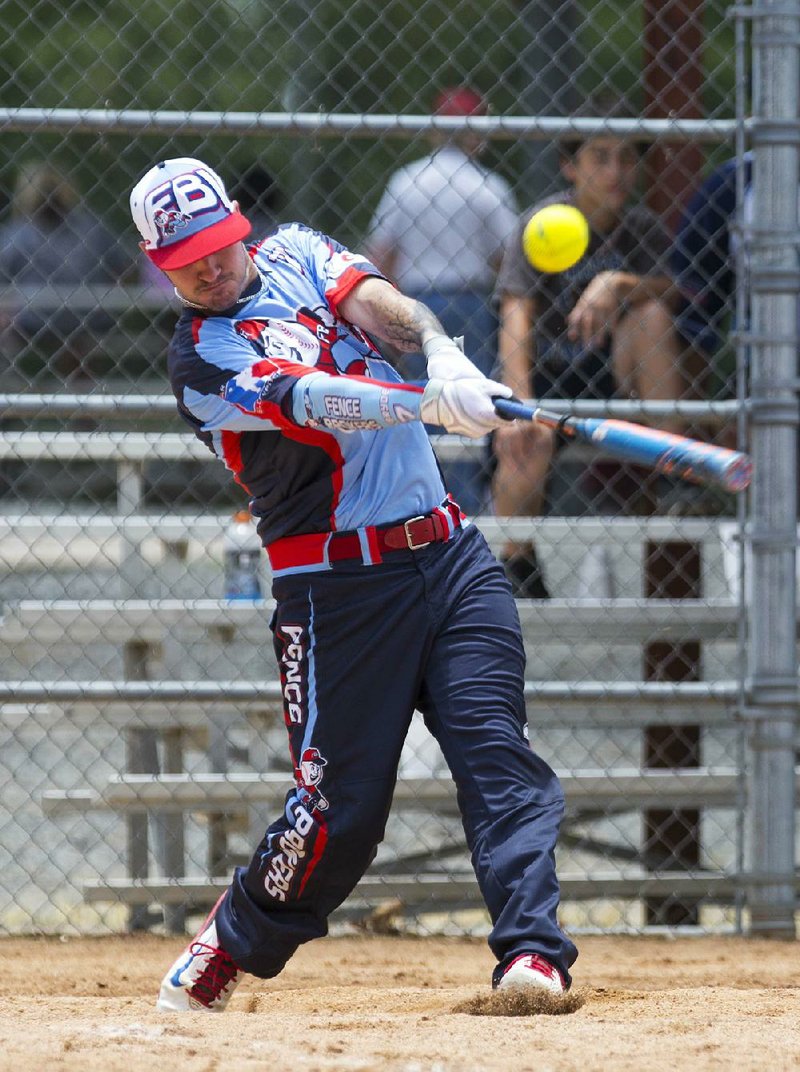 Brian McBryde of the Fence Brokers delivers a base hit in the Fence Brokers’ 21-4 victory over Steel Sunday in the Men’s Major Division Championship game of the Busch Classic at the Sherwood Sports Complex.