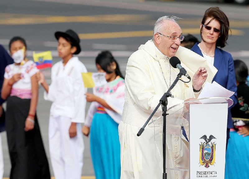 Pope Francis speaks Sunday after arriving at an airport in Quito, Ecuador, for a visit to South America that will include stops in Bolivia and Paraguay.